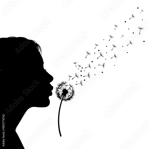 Silhouette of a person blowing dandelion seeds into the air