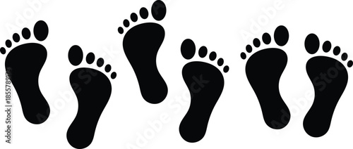 Six black footprints arranged in a scattered pattern on a white background footstep isolated