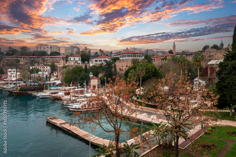 Fototapeta premium Ships in the old harbour in Antalya (Kaleici), Turkey. Old town of Antalya is a popular Tourist destination in Turkey.