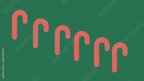 Vibrant candy canes on green background for festive holiday designs
