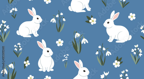 A charming seamless pattern of cute white rabbits and spring snowdrop flowers on a lovely dusty blue background for Easter.