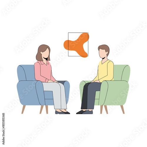 Two people sitting in armchairs engaged in conversation indoors