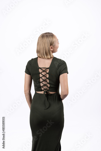 Rear view of woman in green dress with lace-up back