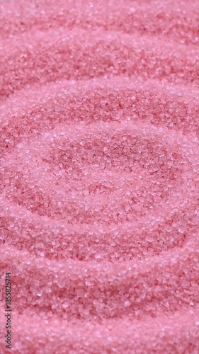 Sweet pink sugar for cotton candy, texture close-up, food background, vertical video