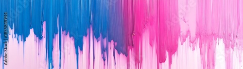 Vibrant pink and blue paint drips on white background with colorful abstract texture