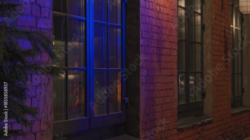 4k, A close-up view of the reflected light in the restaurant window from the warning lights of an ambulance, police car, fire truck, at nighttime