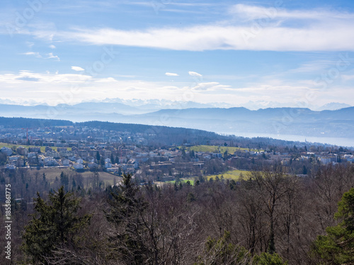 Pfannenstil, Switzerland - March 9th 2025: Beautiful view over villages and the lake Zurich towards the Alps