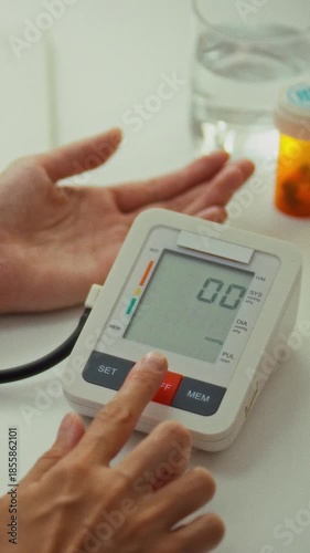 A healthcare provider conducts a patient's routine health assessment using a digital monitor to check blood pressure accurately in a clinical environment