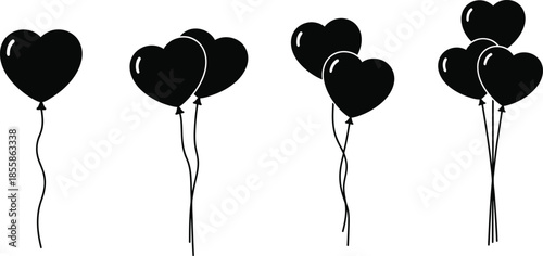 Heart shaped balloons on strings in a row