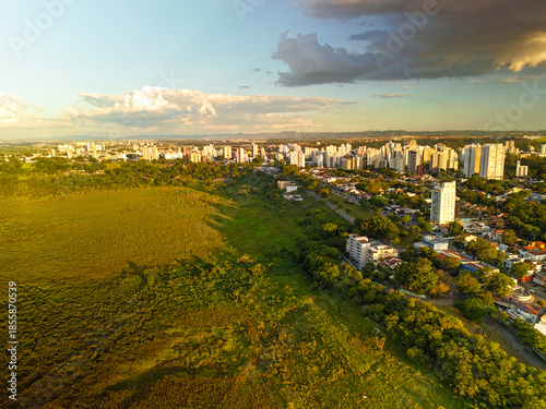 aerial view of a sunset near Banhado in Sao Jose dos Campos with astonishing colors and the city in the background.