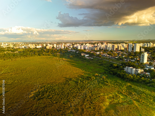 aerial view of a sunset near Banhado in Sao Jose dos Campos with astonishing colors and the city in the background.