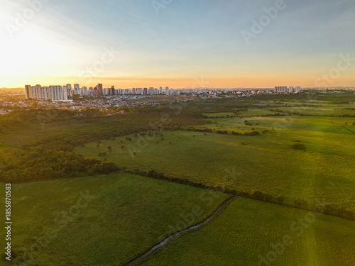 aerial view of a sunset near Banhado in Sao Jose dos Campos with astonishing colors and the city in the background.