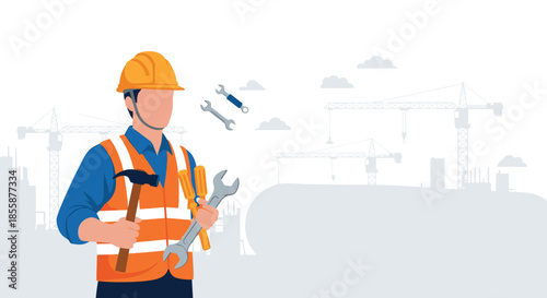 Construction worker in a safety vest and hard hat holding a hammer and wrench with a city building site background and cranes.