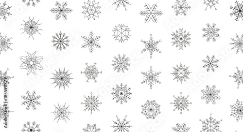 Seamless pattern background with a variety of intricately hand-drawn black snowflakes on a clean white backdrop for winter decor.