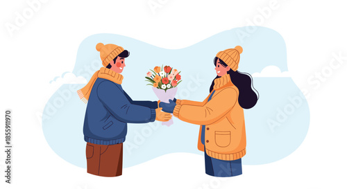 Romantic winter scene with a young man giving a bouquet of flowers to his girlfriend while both are wearing cozy warm clothes.