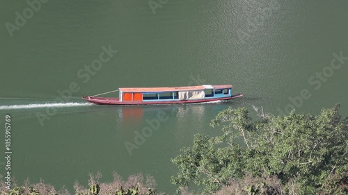  transport boats travel along the river water near the dock pier