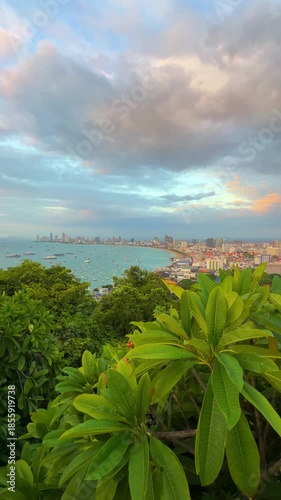The Gulf of Thailand at sunset. View from the observation deck at sunset on Khao Phra Hill, Pratamnak in Pattaya: central beach, waterfront, boats, ferries, and yachts on the turquoise water. Thailand