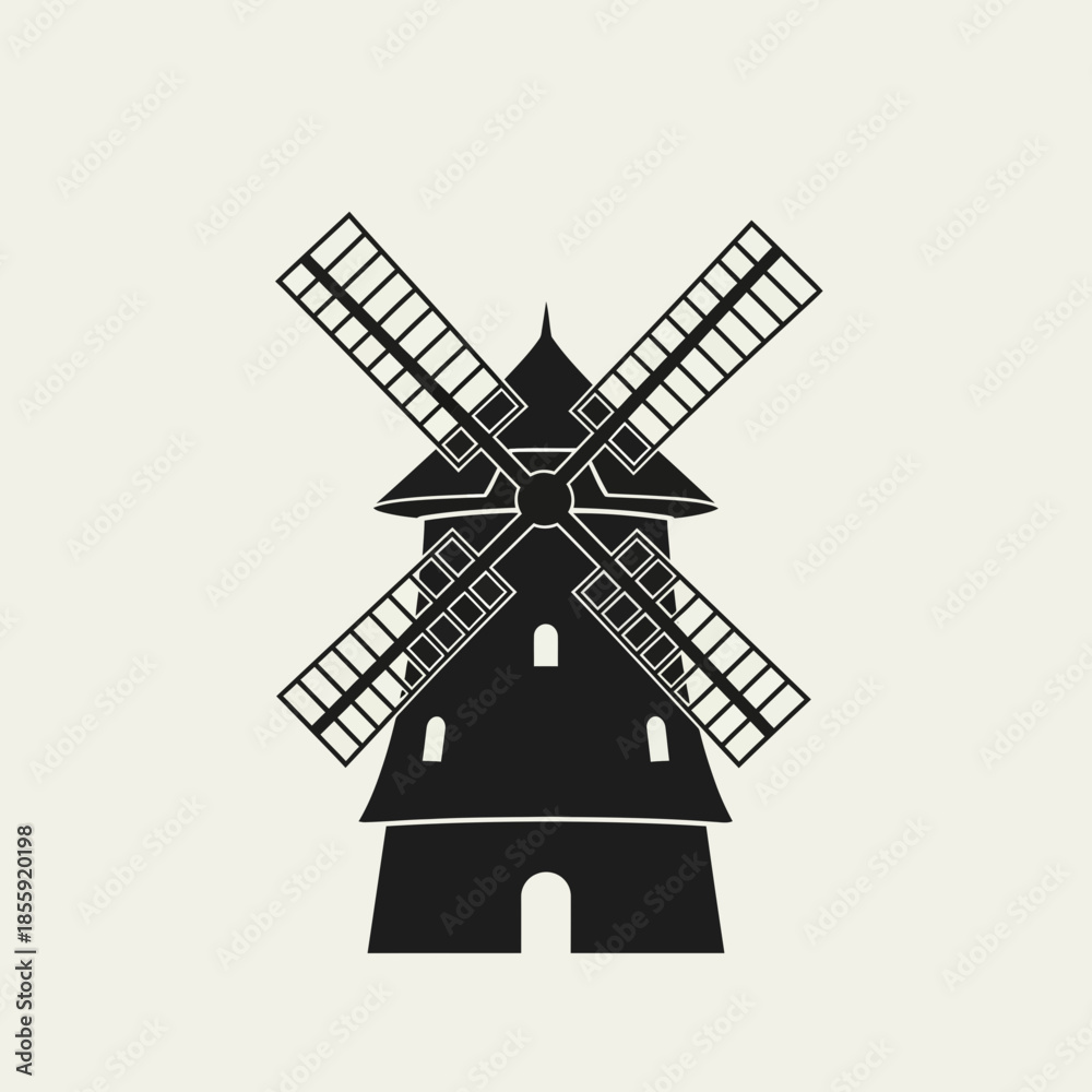 Obraz premium Silhouette of a traditional windmill with four sails.