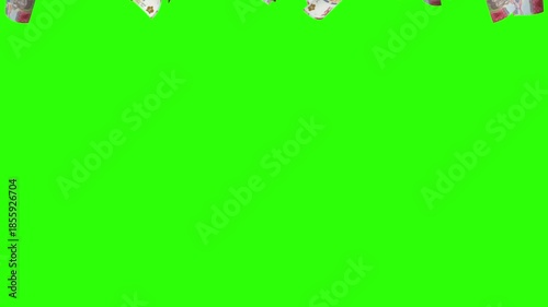 3d animation of 50,000 Rupiah flying in the wind isolated on green screen. Indonesia's paper currency is fifty thousand rupiah.
