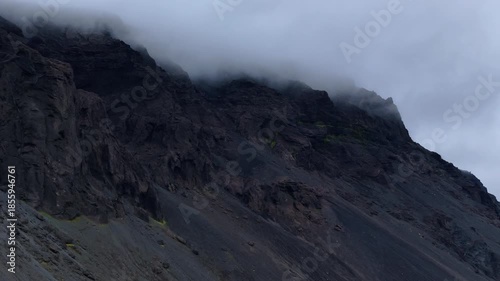 Dark Mountain Cliff Covered by Fog