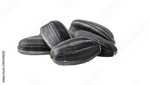 Wallpaper Mural Close-up of a pile of sunflower seeds, featuring dark shells with vertical striped patterns, resting on a black background Torontodigital.ca