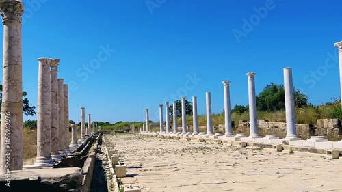 SIDE, TURKEY, June 16, 2024: Ruins of the ancient city of Side in Antalya province on the Mediterranean coast. Amazing ruins of an ancient city. Old statues in the State Agora.The ancient city wall.4K
