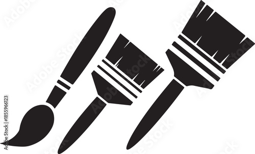 A simple black and white illustration featuring painting brushes 