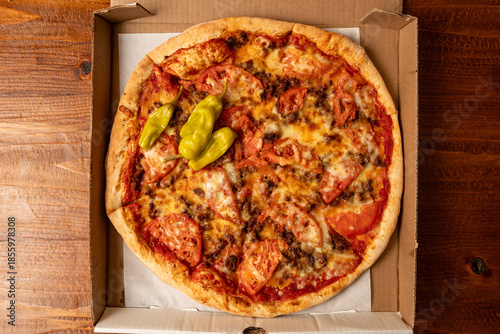 Pizza with tomatoes and sausage