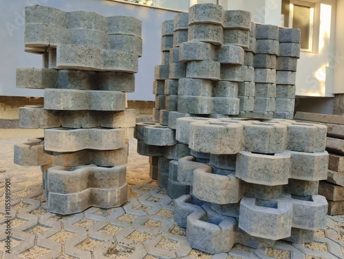 photo of pile of concrete openwork panel pattern diamond shaped paving slab holes of paving cement brick block background hd high quality backdrop