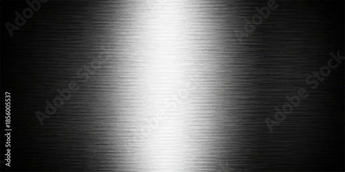 A polished stainless steel plate featuring a brushed metal texture with a shiny silver aluminum surface and industrial grey metallic pattern reflecting a titanium alloy material