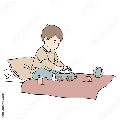 Young boy with calm mood playing during relaxation on a bed background with copy space
