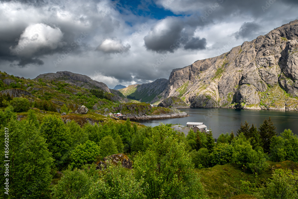 Naklejka premium Old Fishermen Village Nusfjord With Rorbuer Huts And Calm Fjord On Lofoten Islands In Norway