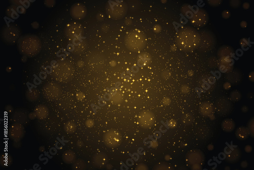 Glowing gold sparkles in light, golden glitter particles background