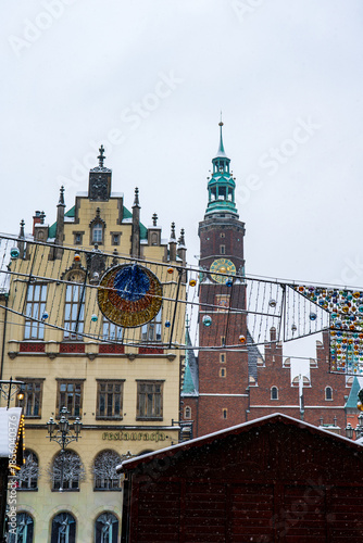 Wroclaw Old Town winter street with Town Hall tower and lights