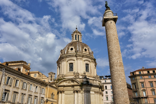 Rome, Italy. Piazza Colonna featuring the Column of Marcus Aurelius and the Basilica of Saints Ambrose and Charles, a historic square in the city center.