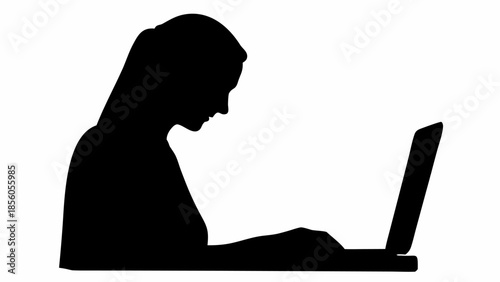 Woman working on laptop in focused silhouette