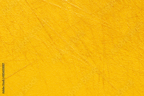 Yellow used plastic chopping board surface texture
