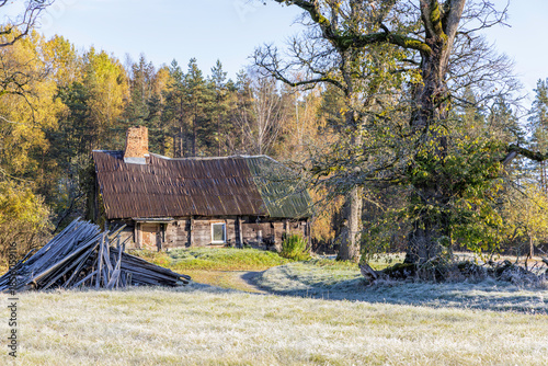 Old Abandoned Wooden House in Winter Frost