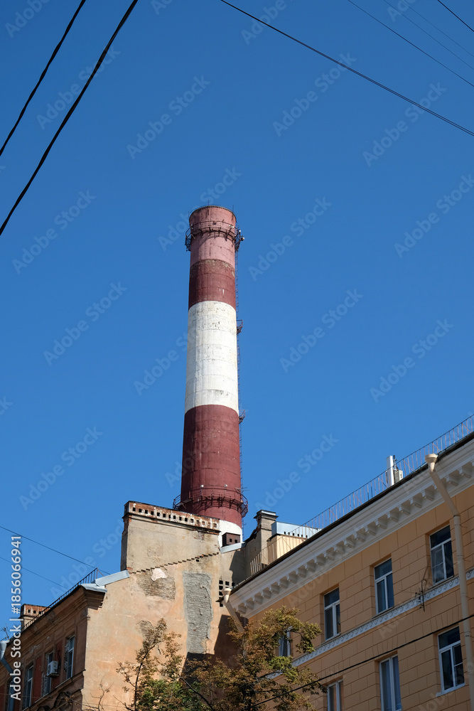 Fototapeta premium striped chimney against blue sky