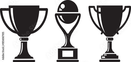 Three black and white trophy with different and a moon symbol on the central one prize