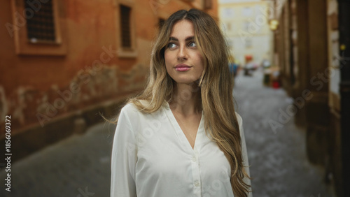 Woman with long blonde hair glances over shoulder in a narrow italian alley; introspection wanderlust serenity. Free Download Woman with long blonde hair glances over shoulder in a narrow italian alley; introspection wanderlust serenity. - GFXLoad
