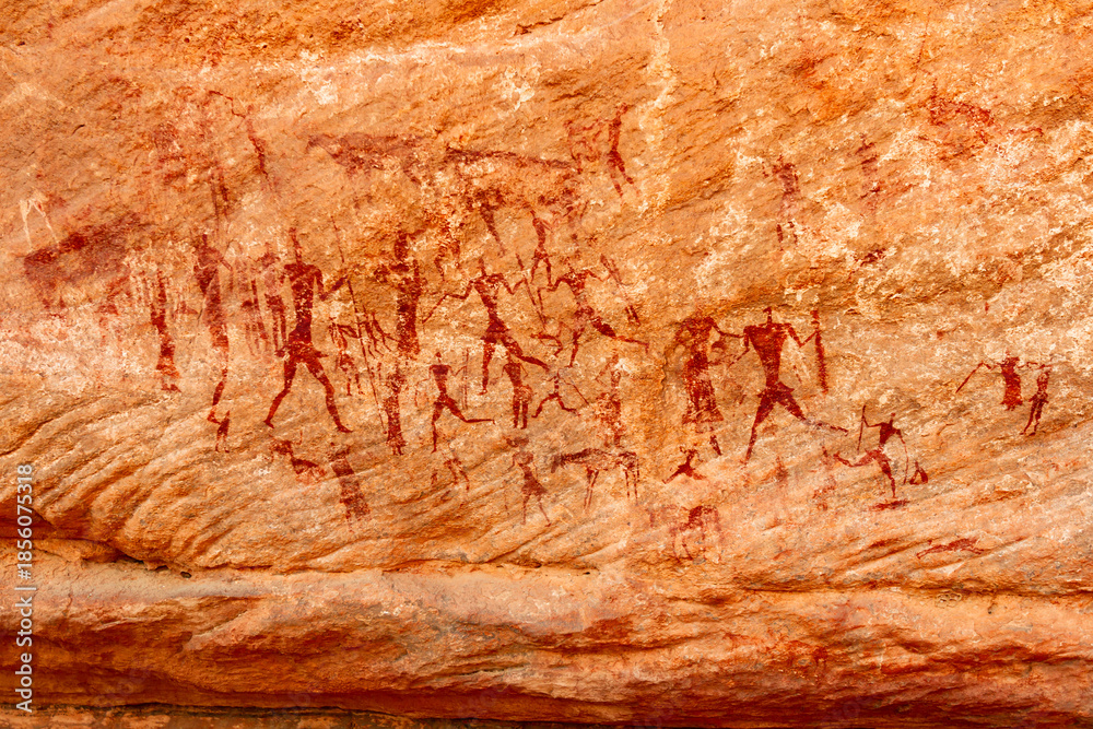 Naklejka premium Neolithic rock art. famous rock paintings depicting people. Bovidian period. Tadrart Rouge. Tassili N'Ajjer National Park, Djanet, Algeria, Africa