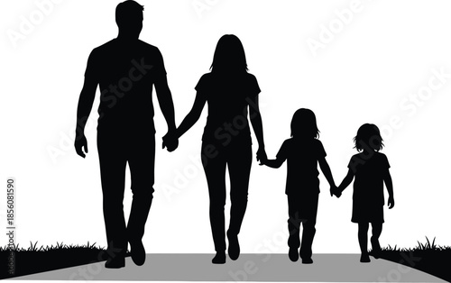 A family of four walking together in silhouette