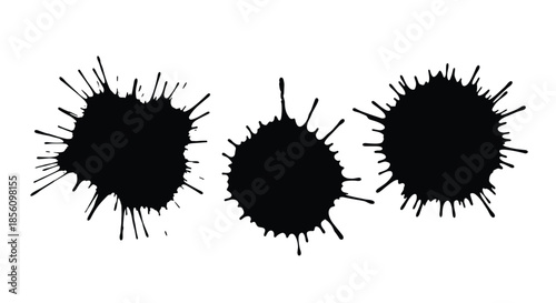 Three black ink splatters or paint blots of varying sizes on a white background, useful as creative design elements or textures.