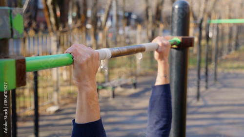 Close up of hands on a pull-up bar
