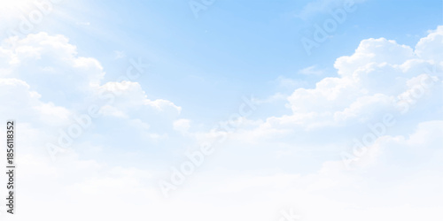 Beautiful blue sky with fluffy white clouds, a clear summer cloudscape