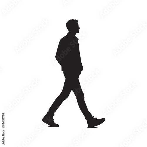 Black silhouette of a man walking with hands in pockets male person