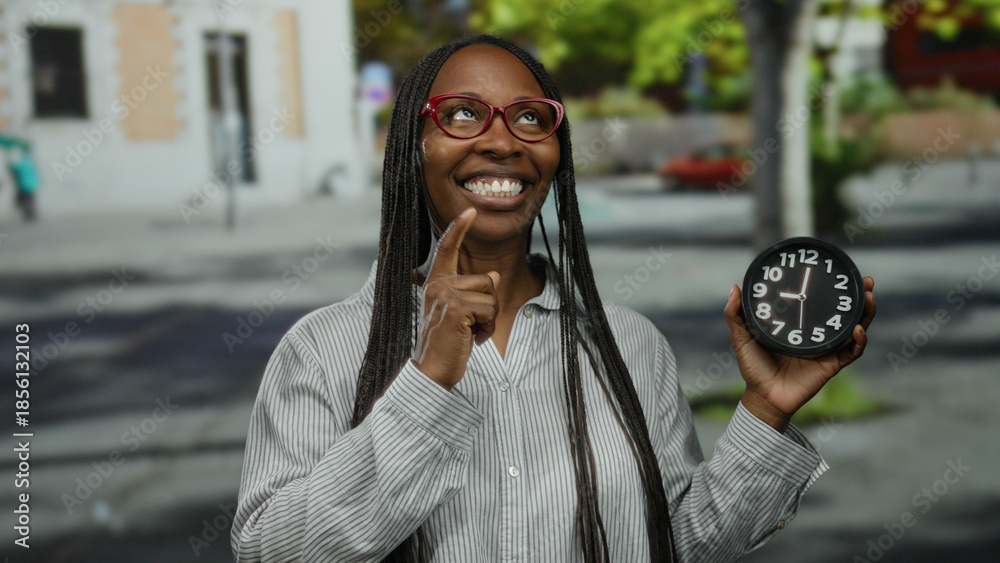 Fototapeta premium Woman with glasses holding clock outdoors on city street expressing various emotions in striped shirt during daytime.