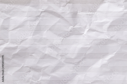 Blank musical stave from music notebook, white lined crumpled paper for design