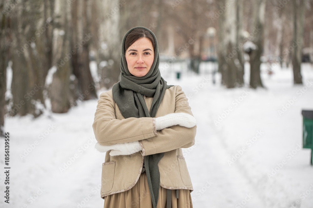 Fototapeta premium Winter portrait of a middle-aged brunette model